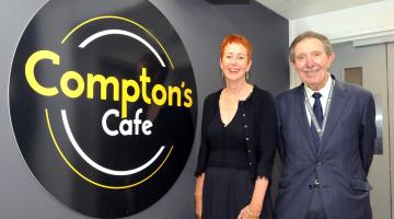 Cllr Roger Lees and Chairman of the Board Ros Keeton with the Compton's Cafe logo