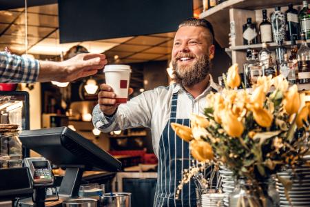 Barista serves a customer