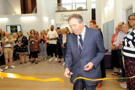 Cllr Roger Lees cutting the ribbon 